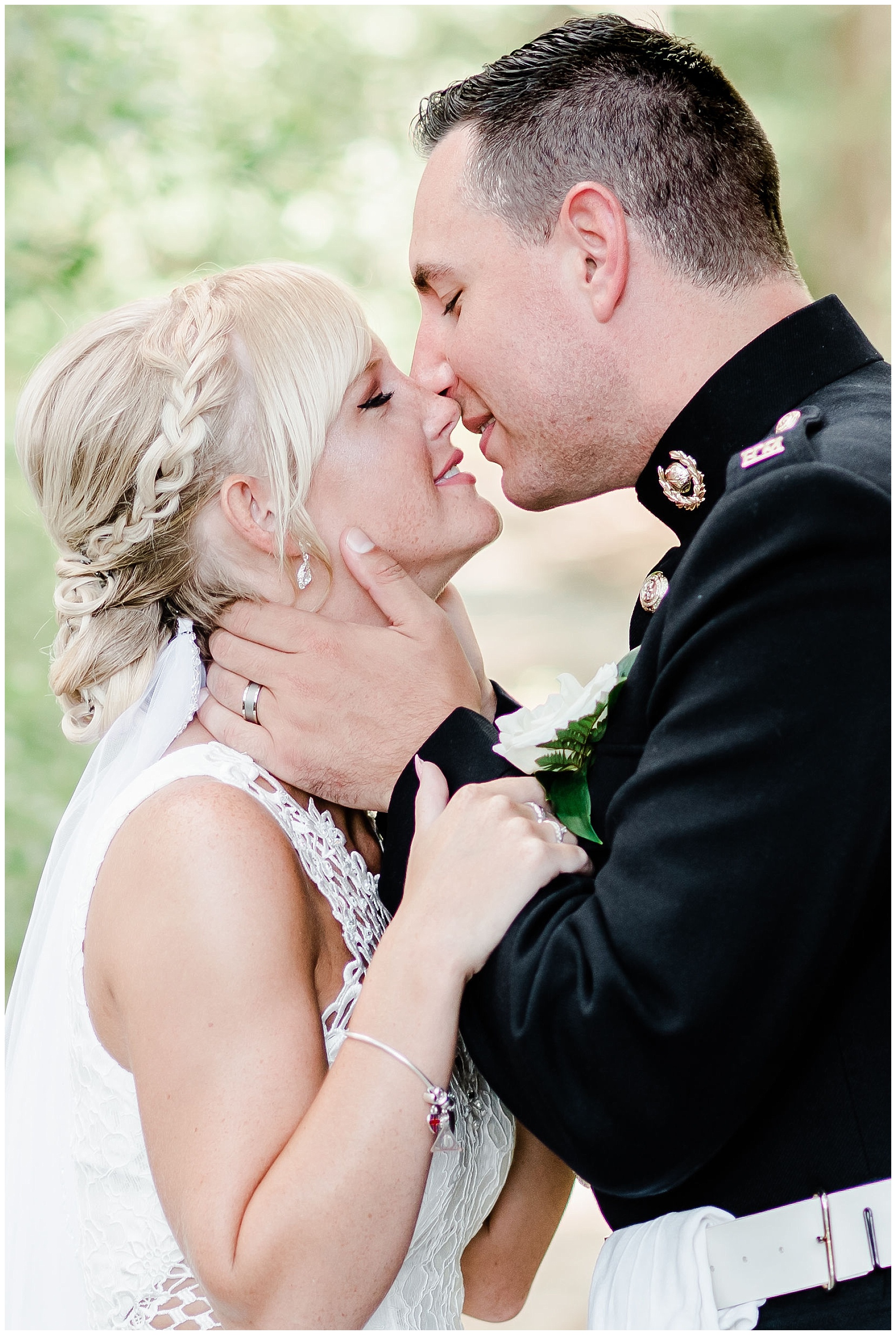 bride and groom kiss at their woodsy elopement